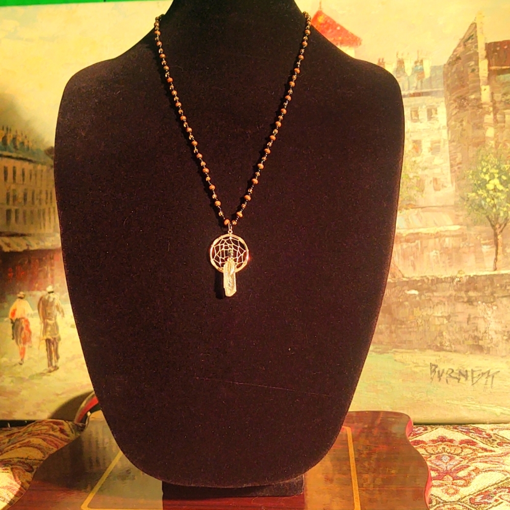 Dreamcatcher and crystal on blk and brn beaded necklace